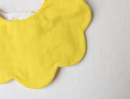 Yellow scalloped bib