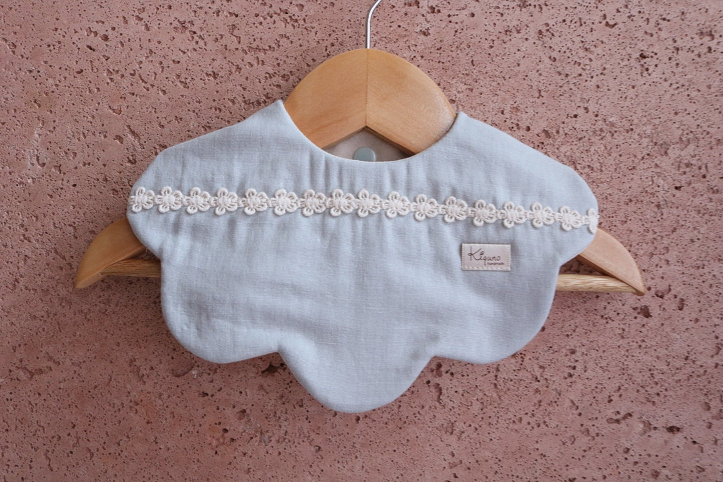 Scalloped bib with flower lace