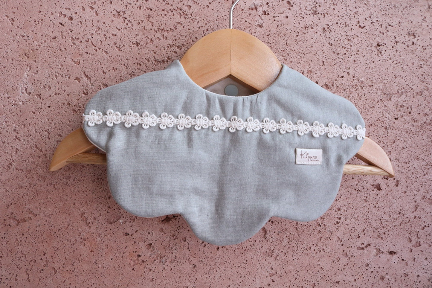 Scalloped bib with flower lace