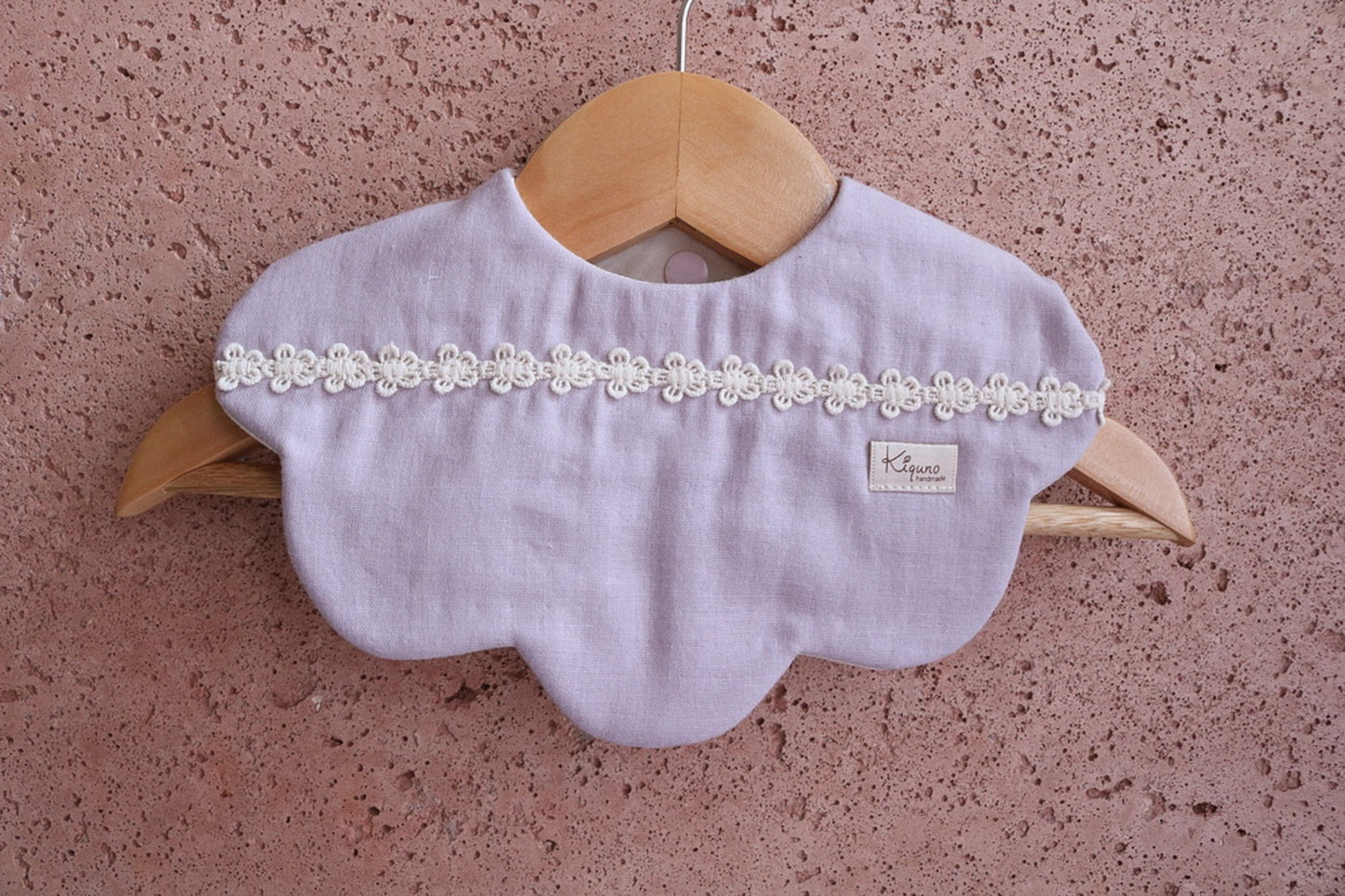 Scalloped bib with flower lace